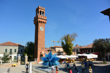 Murano with glass monument in the middle of Campo Santo Stefano, Veneto, Italy