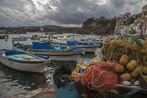 Fishing boats and nets in Procida island, Campania, Italy