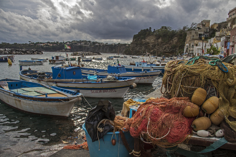 Fishing boats and nets in Procida island, Campania, Italy