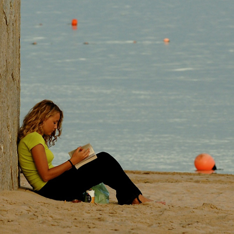Girl reading at the beach